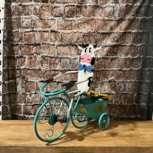 cow on tricycle